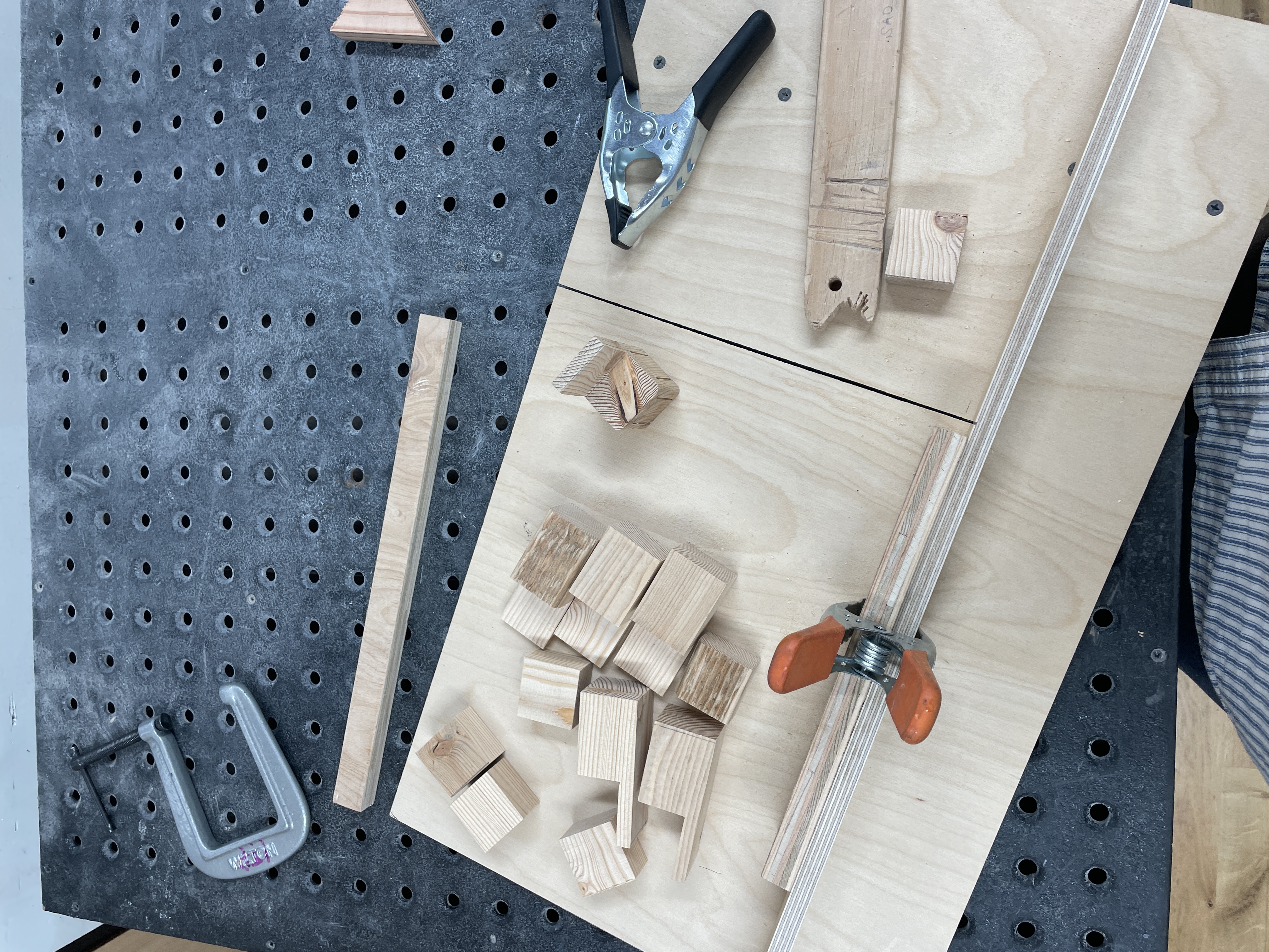 Cutting wooden pieces to create chairs