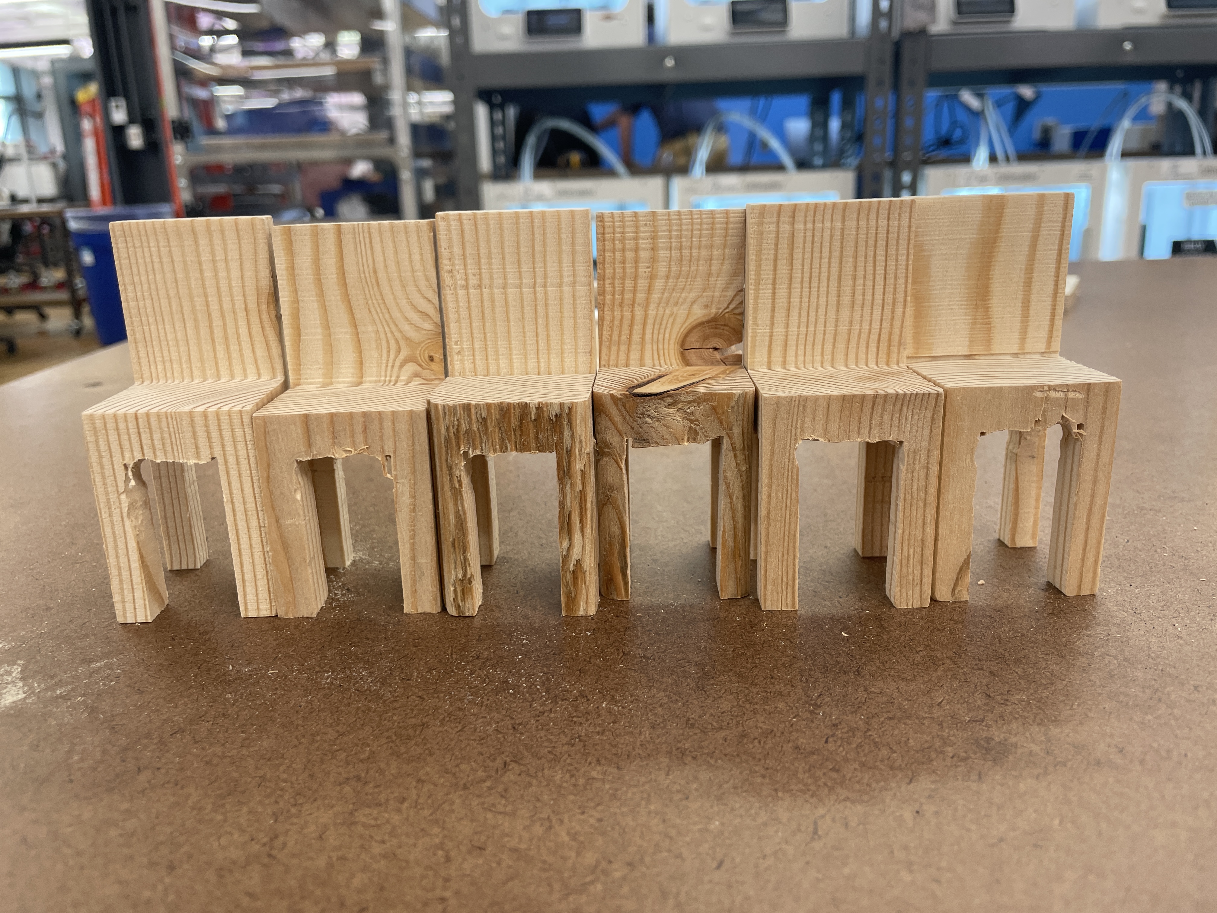 Six finished smalll wooden chairs side-by-side